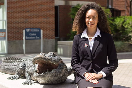 woman beside alligator thumbnail