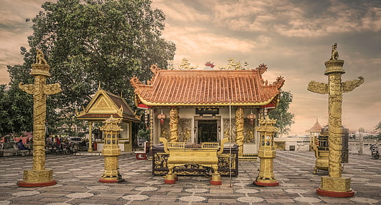 white and brown temple under white clouds during daytime thumbnail