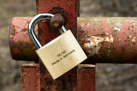 gray padlock on red metal frame thumbnail