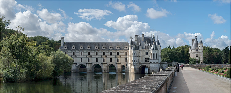 white and gray concrete building above body of water thumbnail