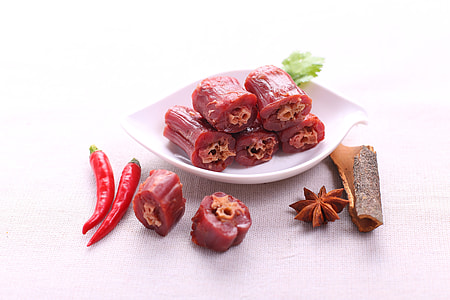 red chili and brown bark near white ceramic saucer thumbnail