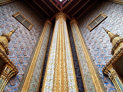 low angle photography of gray and gold building thumbnail