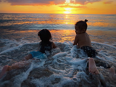 Photo of Two Girls in Beach during Golden Hour thumbnail