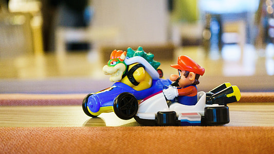 selective focus of Super Mario riding on car toy thumbnail