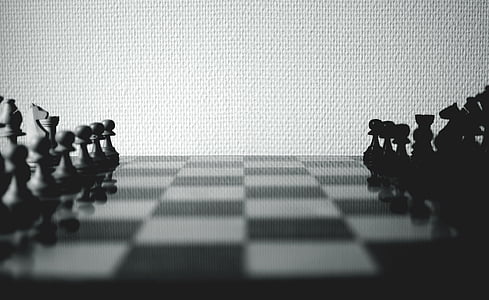 greyscale photo of chessboard with arranged piece thumbnail