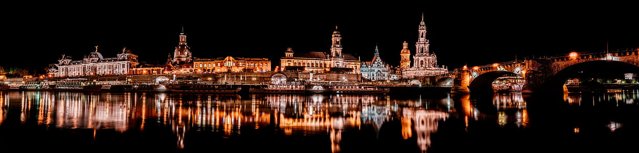 Lighted Buildings Near Body of Water thumbnail