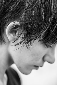 person with piercing grayscale photo thumbnail
