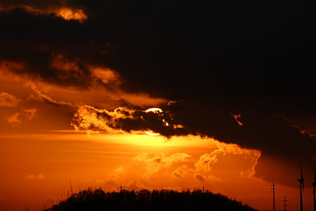 silhouette of clouds and mountain golden hour photography thumbnail