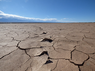 brown dried lake under blue sky thumbnail