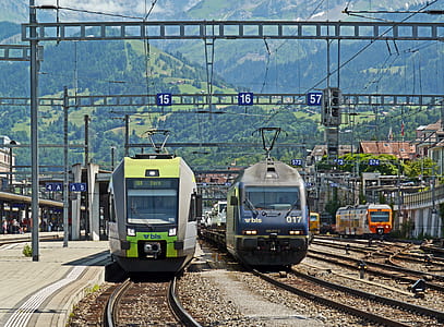 two trains on train rails during daytime thumbnail