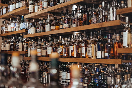 assorted-brand glass bottle lot in shelf thumbnail