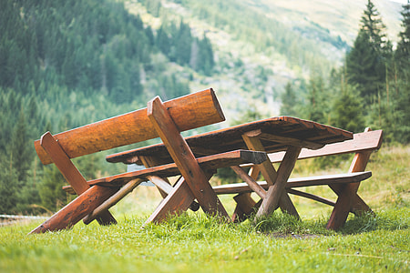 Wooden Picnic Seating Area in the Middle of Mountains thumbnail