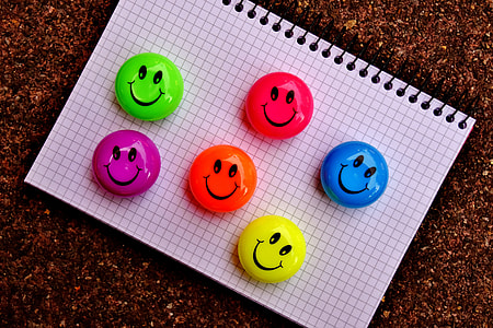 six assorted-color smiley ornaments on printer paper thumbnail