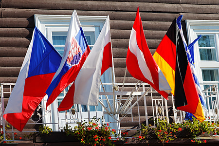 assorted flags hanging on the fence thumbnail