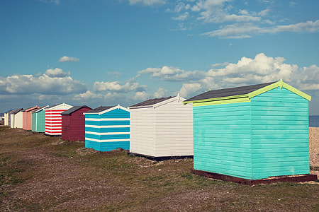 Coloured beach huts sit on the coast of Greatstone in Kent, Southern England. Image captured with a Canon DSLR thumbnail