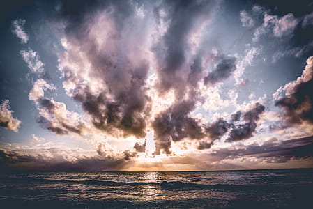 Calm Body of Water With Cloudy Skies thumbnail