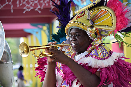 selective focus photography of man playing trombone thumbnail
