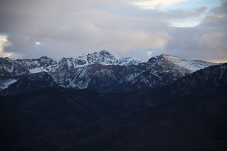 snow covered mountains during daytime thumbnail
