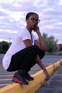 Photo of a Woman Wearing White Shirt and Black Pants thumbnail