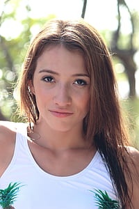 woman in white sleeveless top thumbnail