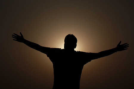 silhouette photo of man standing thumbnail