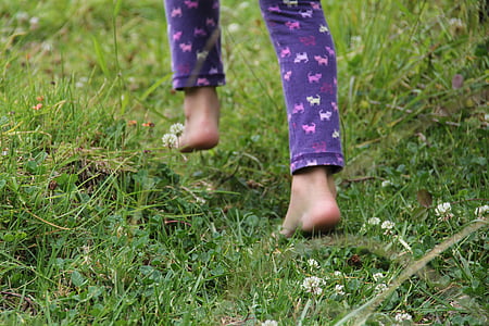person in purple animal print pajama pants on grass field thumbnail