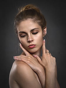 topless woman wearing red lipstick with hand gestures on face thumbnail