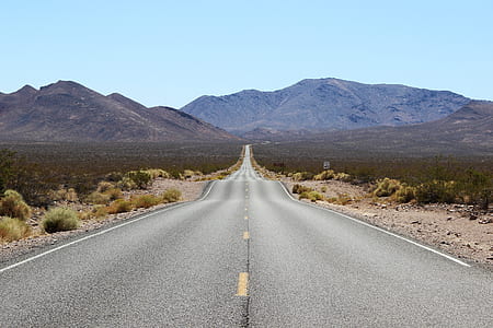concrete road going through mountains thumbnail