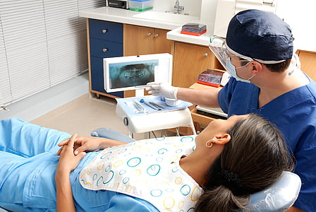 dentist checking woman teeth thumbnail