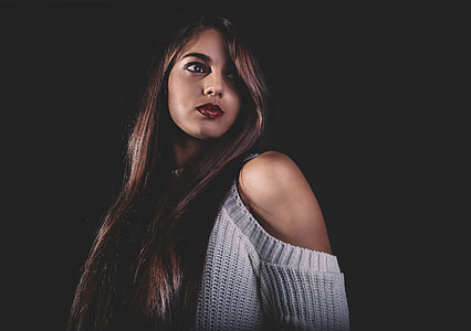 woman wearing gray cold-shoulders sweater looking sideways thumbnail
