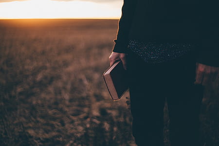 person holding book thumbnail