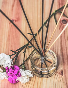 white and purple flowers on top of brown surface thumbnail