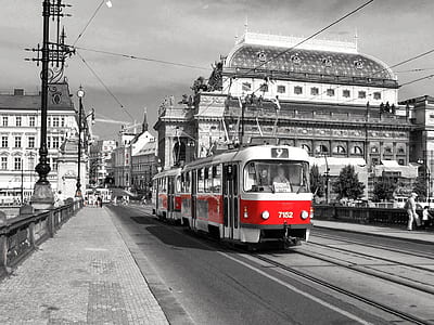 selective color photography of tram passing road thumbnail