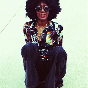 woman wearing white, black, and brown button-up long-sleeved shirt thumbnail