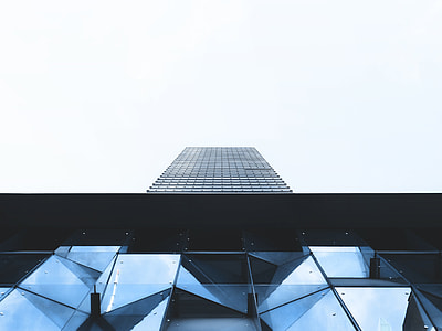 long angle photo of mirror wall high rise building under white sky thumbnail