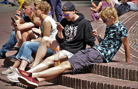man wearing teal and black crew-neck shirt and gray cargo shorts thumbnail