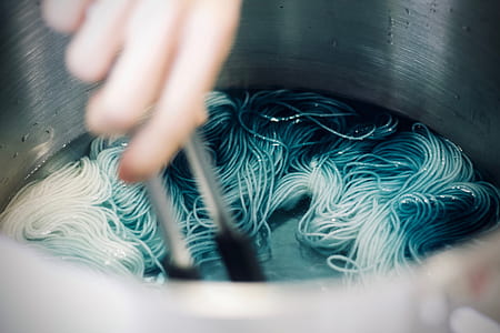 person cooking pasta thumbnail