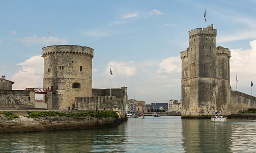 gray concrete building near water thumbnail