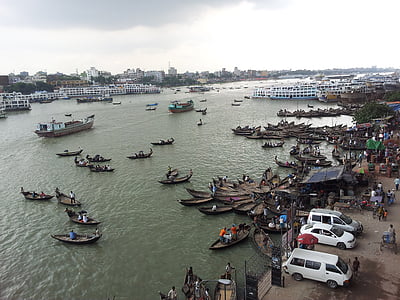 boats on river near vehicles and buildings at daytime thumbnail