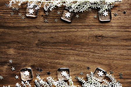 six snowflake paperweights on brown wooden tabletop thumbnail