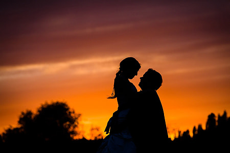 silhouette of woman and man in golden hour photography thumbnail