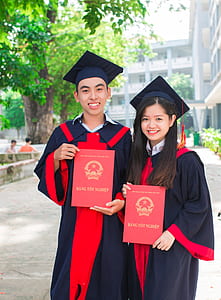 man and woman wearing academic suits thumbnail