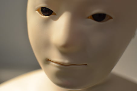 white face doll closeup photography thumbnail