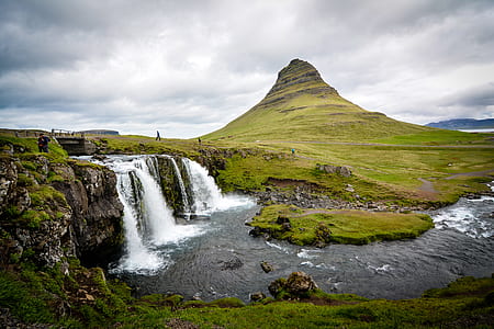 time-lapse landscape photography of people gathered near waterfalls thumbnail