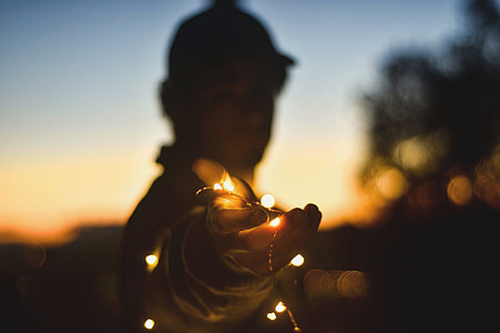 person, string, lights, white sky thumbnail