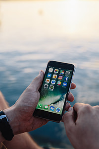 Mobile phone in man's hands near the sea thumbnail