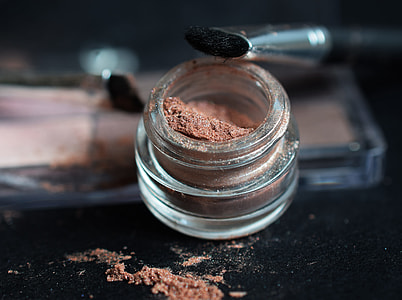 clear glass container with brown powder thumbnail