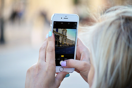 person holding iPhone 6 taking photo thumbnail
