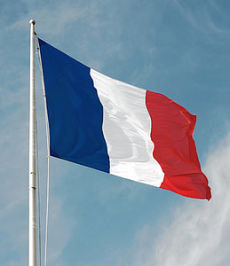 France flag under blue sky with white clouds thumbnail
