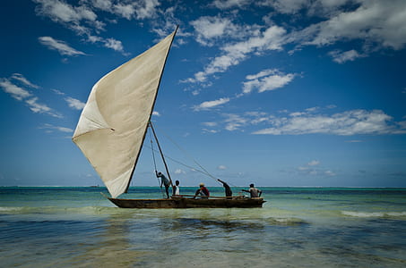group of people riding on black and white boat thumbnail